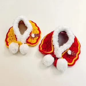 Handcrafted pet cape detail, festive knitted cat scarf with fluffy trim and cute pompom charms.