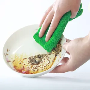Microfiber dish cloth detail showing powerful cleaning performance removing stains easily.