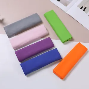 Detailed view of colorful quick dry sports towels, rolled neatly for outdoor cooling and sweat.