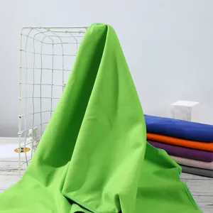 Green cooling towel for outdoor sports, quick dry microfiber sweat absorbent towel detail view.
