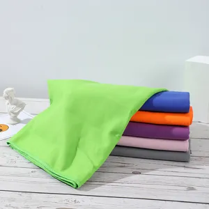 Detailed view of colorful solid quick drying cooling sports towels stack for outdoor fitness