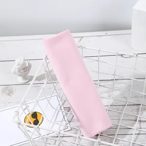 Detailed view of the pink cooling towel neatly placed in a white wire basket for sports.