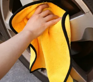 Microfiber car cleaning towel detail view, thick absorbent cloth for auto detailing.