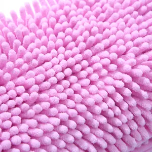 Close-up detail of soft pink chenille microfiber towel, highly absorbent fluffy fabric texture