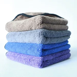 Detailed view of thick microfiber cleaning towels featuring soft texture and durable black edges.