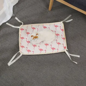 Close-up detail of summer pet cooling mat with cute flamingo pattern and secure corner ties.
