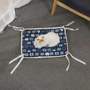 Detailed view of blue cat pattern pet cooling mat with lace trim and corner ties for summer.