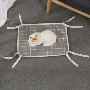 Pet cooling mat detail, grey grid pattern with lace edge and corner ties for cats and dogs.