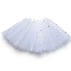 Detailed view of white girls tutu skirt with sparkly stars and tulle layers for dance show.