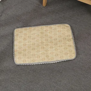 Summer pet cooling mat detail showing breathable woven rattan texture and clean gray border edge.