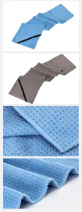 Close-up details of microfiber sports towel with zipper pocket showing soft texture.