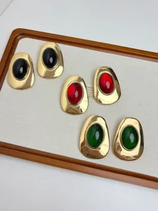 Vintage style irregular metal earrings with black red green resin stones, elegant detail.