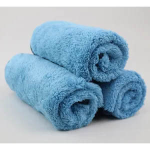 Blue microfiber car wash towel rolled set for easy and efficient vehicle cleaning routine.