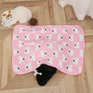 Coral fleece pink pet blanket detail featuring cute white bear print design for warmth.