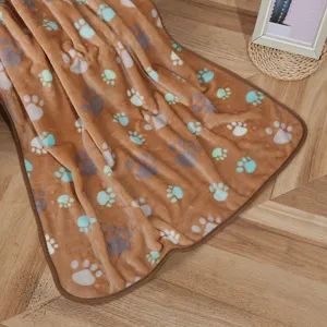 Cozy brown pet flannel blanket with cute paw print design, soft and warm for cats and dogs.