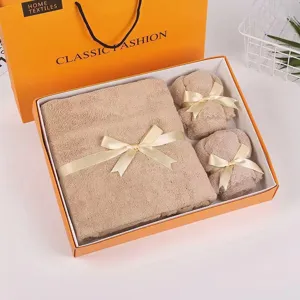 Coral fleece towel gift set with three pieces in an elegant orange box for holidays and weddings.