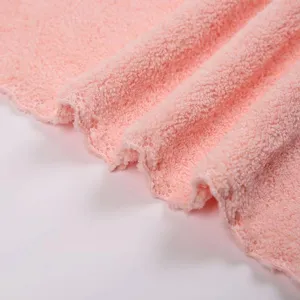 Soft pink coral fleece bath towel with delicate lace edge, perfect gift or daily home use.