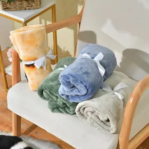 Soft coral fleece pet blankets in rolled set with ribbon ties, warm and cozy for cats dogs.