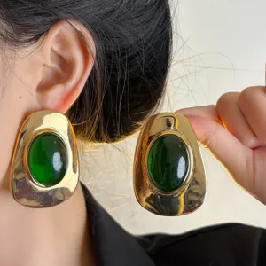 Vintage chunky gold earrings with dark green resin stone for women statement jewelry.