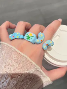 Sweet blue drip oil rings featuring cute colorful stars and flowers, fashionable dopamine jewelry.