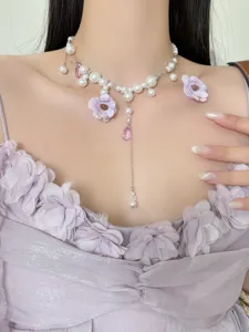Korean style floral pearl tassel necklace detailed shot showing elegant purple flower design.
