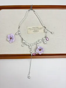 Details of the Korean style flower pearl tassel necklace with elegant purple crystal drops.