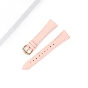 Pink leather watch strap replacement with golden buckle, lychee texture, elegant women style.