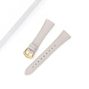 Close-up of grey leather watch strap with gold buckle, fine lychee texture detail view.