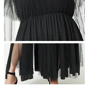 Black gothic mesh dress detail showing layered tulle skirt and pleated waistline style.