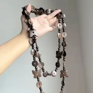 Lange houten kralen ketting met knopen vlinder hangers voor vrouwen vintage trui ketting