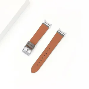 Brown genuine leather watch strap detail, compatible with smartwatches, stainless steel buckle.
