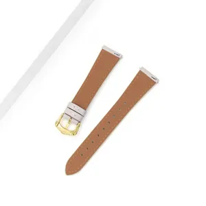 Close-up detail view of brown leather watch strap with elegant gold buckle and quick-release pins.