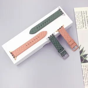 Detailed view of leather quilted watch bands for smartwatches, elegant pink and green styles.