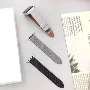 Detailed shot of quilted leather watch bands in multiple colors, featuring metal connectors and clasps.