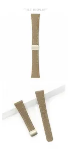 Detailed view of leather watch strap with litchi grain, white stitching and magnetic clasp.