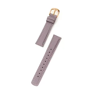Detailed view of genuine leather watch strap, litchi pattern with rose gold buckle.