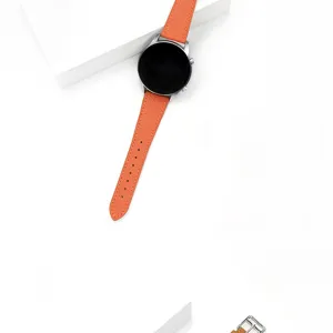 Cinturino di ricambio per smartwatch in pelle arancione, dettaglio di consistenza e fibbia.