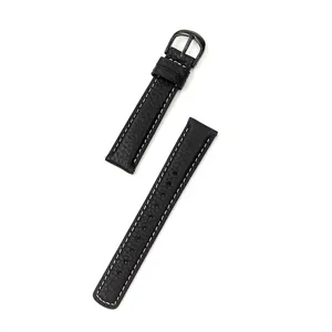 Close-up of black leather watch strap with white stitching and metal buckle detail.