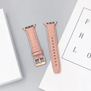 Pink leather watch strap replacement for smart watch with rose gold buckle and connectors.