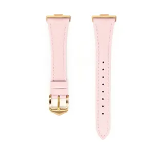 Pink genuine leather watch strap detail, featuring gold tone metal buckle and connectors.
