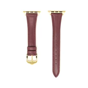 Vista dettagliata del cinturino per orologio in pelle bordeaux con connettori dorati e fibbia.