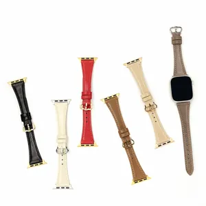 Detalle de las correas de reloj de cuero delgado que muestran varios colores y hebillas.