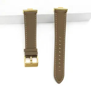 Premium brown leather watch strap replacement with gold buckle for smart watch details view.