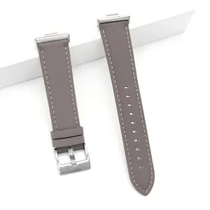 Grey leather watch strap compatible with smartwatch, stylish replacement band with silver buckle.