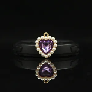 Close-up detail of 18mm heart-shaped pendant with purple crystal and white pearls.
