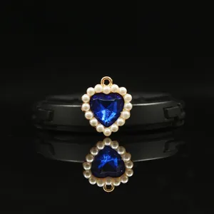 18mm gold alloy heart pendant with blue gemstone and full pearls for DIY jewelry making.