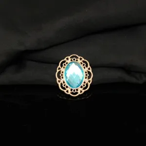 Gold-tone filigree metal alloy frame with light blue oval rhinestone for DIY crafts and decor.