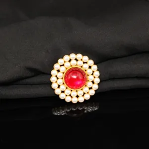 Detail view of a vintage round pearl double-layer rhinestone brooch DIY hair accessory.