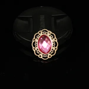 Close-up detail of oval pink rhinestone alloy lace flower DIY craft accessory trim.