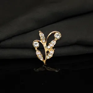 Close-up detail of rhinestone branch leaf alloy accessory, sparkling crystal design for DIY.